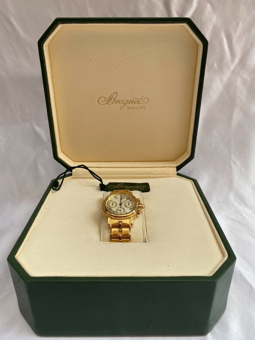 Breguet Marine Chronograph 18K Gold Automatic Watch with Boxes: Breguet Marine Chronograph 18K Gold Automatic Watch with Boxes Discover the elegance of this Breguet Marine Chronograph, a stunning wristwatch crafted in 18K yellow gold. Circa 1990s, this exquisite t