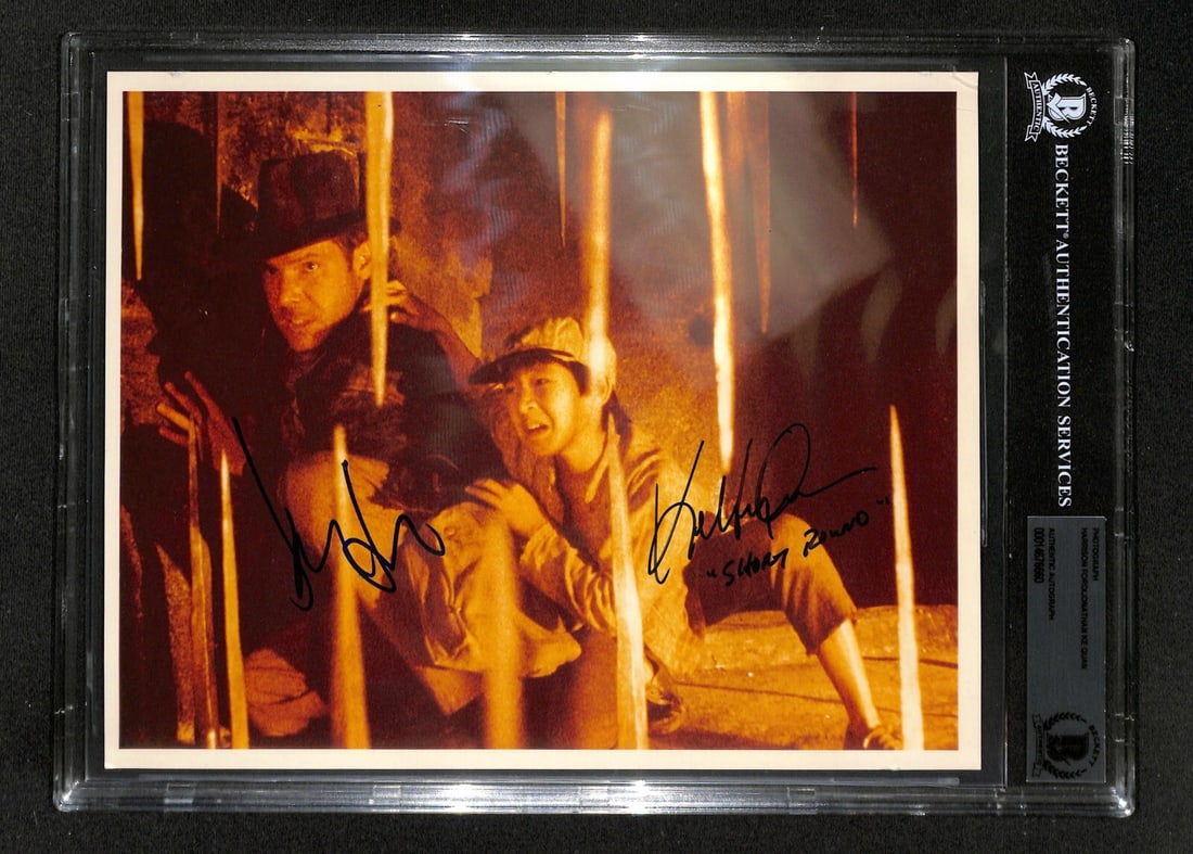 Harrison Ford Ke Huy Quan Signed 8x10 Photo Indiana Jones BAS Authenticated: Harrison Ford Ke Huy Quan Signed 8x10 Photo Indiana Jones BAS Authenticated This striking 8x10 color photograph features the legendary Harrison Ford as Indiana Jones and Ke Huy Quan as Short Round fro