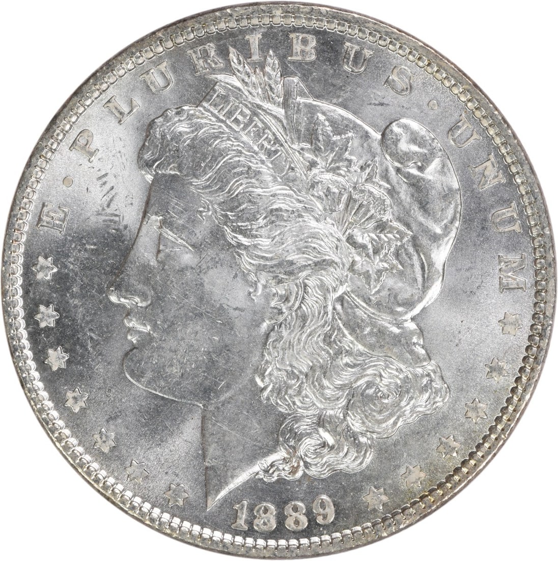 1889 Morgan Silver Dollar Choice BU Uncertified Silver Coin: 1889 Morgan Silver Dollar Choice BU Uncertified Silver Coin This 1889 Morgan Silver Dollar is a remarkable piece of numismatic history, showcasing its uncirculated condition. The coin is composed of s