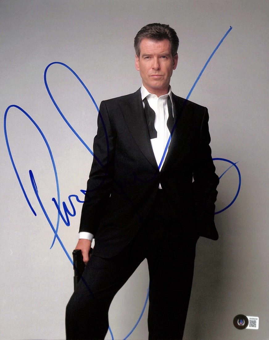 11x14 Photo Signed by Pierce Brosnan as James Bond with Beckett Authentication: 11x14 Photo Signed by Pierce Brosnan as James Bond with Beckett Authentication This 11x14 photograph features Pierce Brosnan as James Bond, personally signed in blue permanent marker by the actor. The