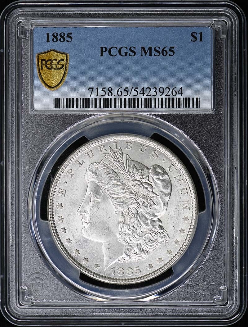 PCGS MS65 1885 Morgan Silver Dollar from Philadelphia Mint: PCGS MS65 1885 Morgan Silver Dollar from Philadelphia Mint This is an 1885 Morgan Dollar graded MS65 by PCGS. The coin is uncirculated and was minted in Philadelphia. It is a pre-owned collectible fro