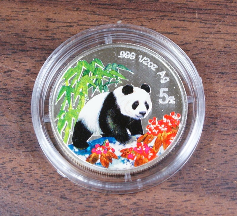 1997 Colorized Silver Proof 5 Yuan Coin With Certificate of Authenticity: 1997 Colorized Silver Proof 5 Yuan Coin With Certificate of Authenticity This 1997 Chinese 5 Yuan colorized silver proof coin features a reverse design with a giant panda in a forest, highlighted with