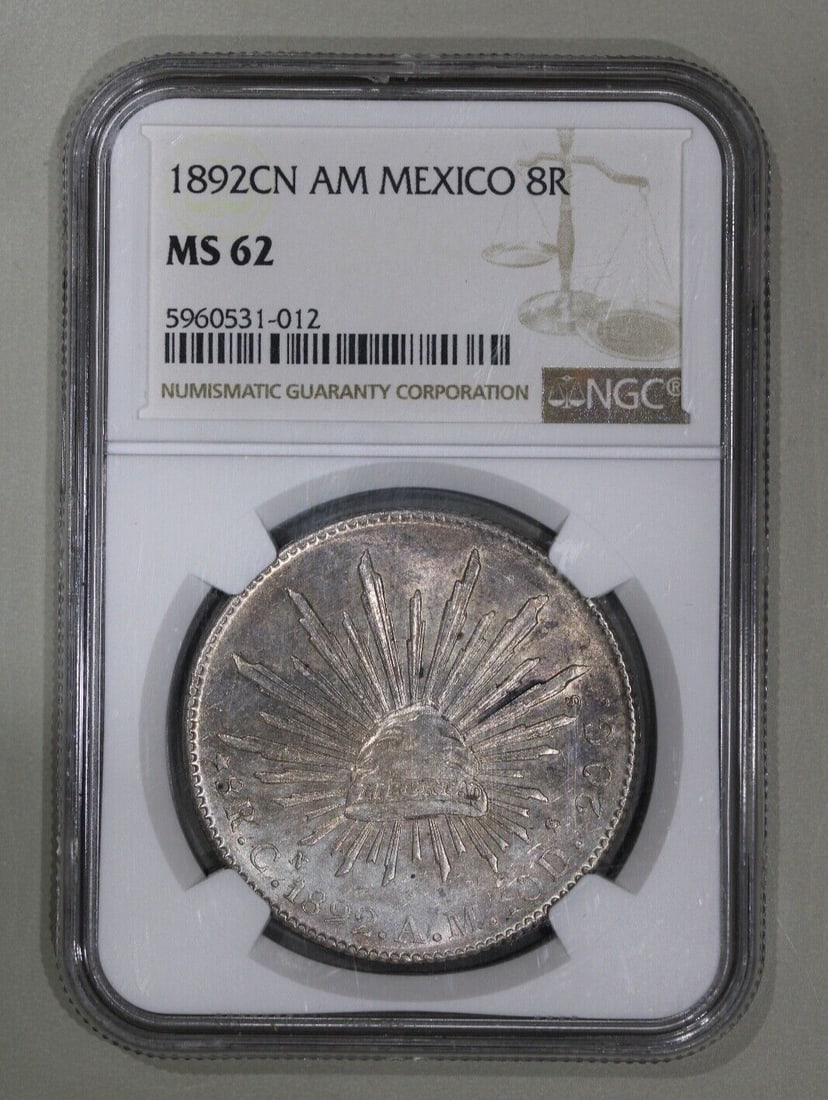 1892-Cn Mexico Cap & Rays 8 Reales NGC MS62 Uncirculated Silver Coin: 1892-Cn Mexico Cap & Rays 8 Reales NGC MS62 Uncirculated Silver Coin This stunning 1892-Cn Mexico Cap & Rays 8 Reales coin is a remarkable piece of history from the Second Republic period (1867-1905).