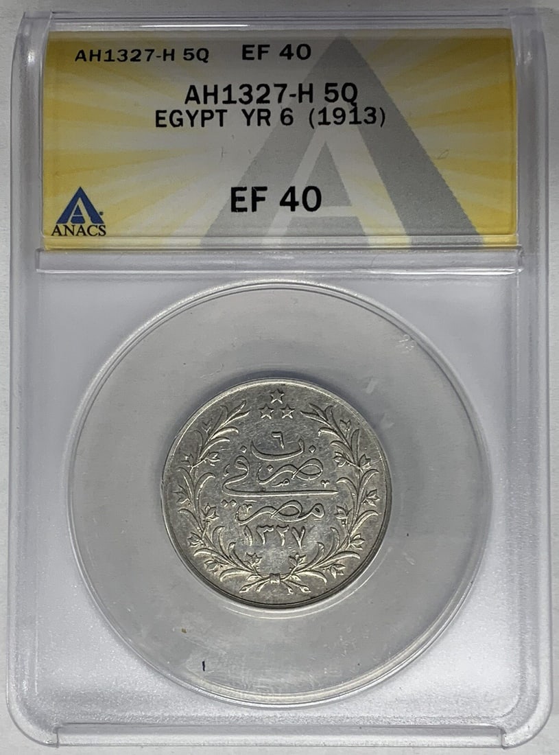 1913 Egypt 5 Qirsh Silver Coin ANACS XF 40 Year 6: 1913 Egypt 5 Qirsh Silver Coin ANACS XF 40 Year 6 This 1913 Egyptian 5 Qirsh coin, Year 6 of the AH 1327-H series, is composed of silver and has been certified by ANACS with a grade of XF 40. The coin