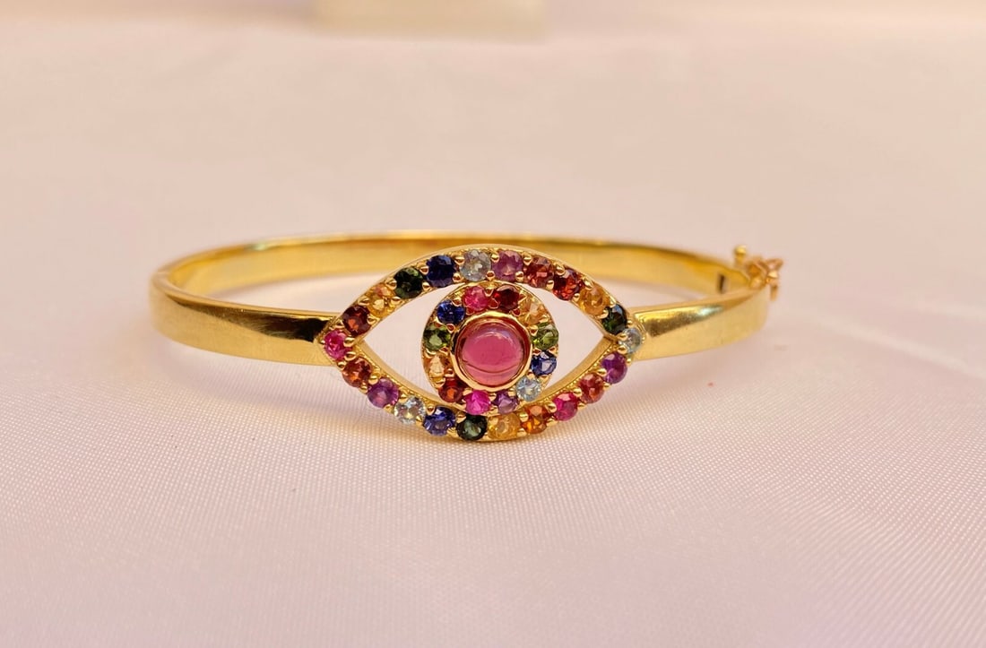 Stunning 18K Yellow Gold Gemstone Cuff Bracelet with Ruby Sapphire Citrine Garnet Tourmaline: Stunning 18K Yellow Gold Gemstone Cuff Bracelet with Ruby Sapphire Citrine Garnet Tourmaline This exquisite 18K yellow gold cuff bracelet showcases a stunning array of gemstones including Sapphire, Ru