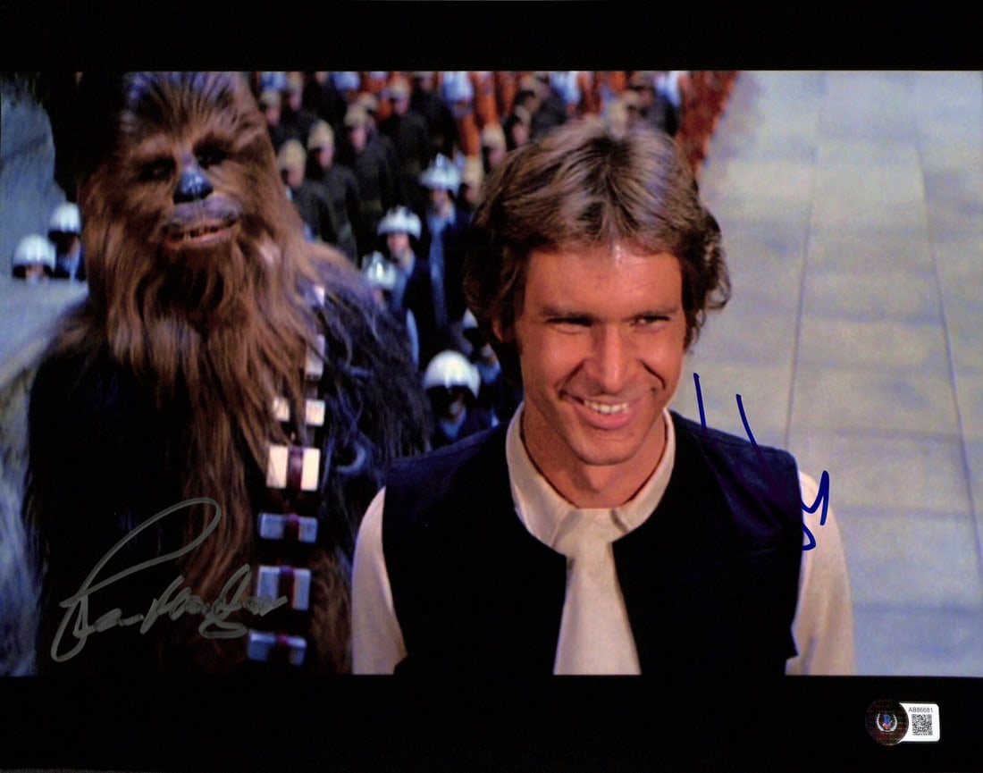 11x14 Star Wars Photograph Signed by Harrison Ford and Peter Mayhew Beckett LOA: 11x14 Star Wars Photograph Signed by Harrison Ford and Peter Mayhew Beckett LOA This is an original 11x14 inch color photograph from the Star Wars franchise, autographed by actors Peter Mayhew and Har