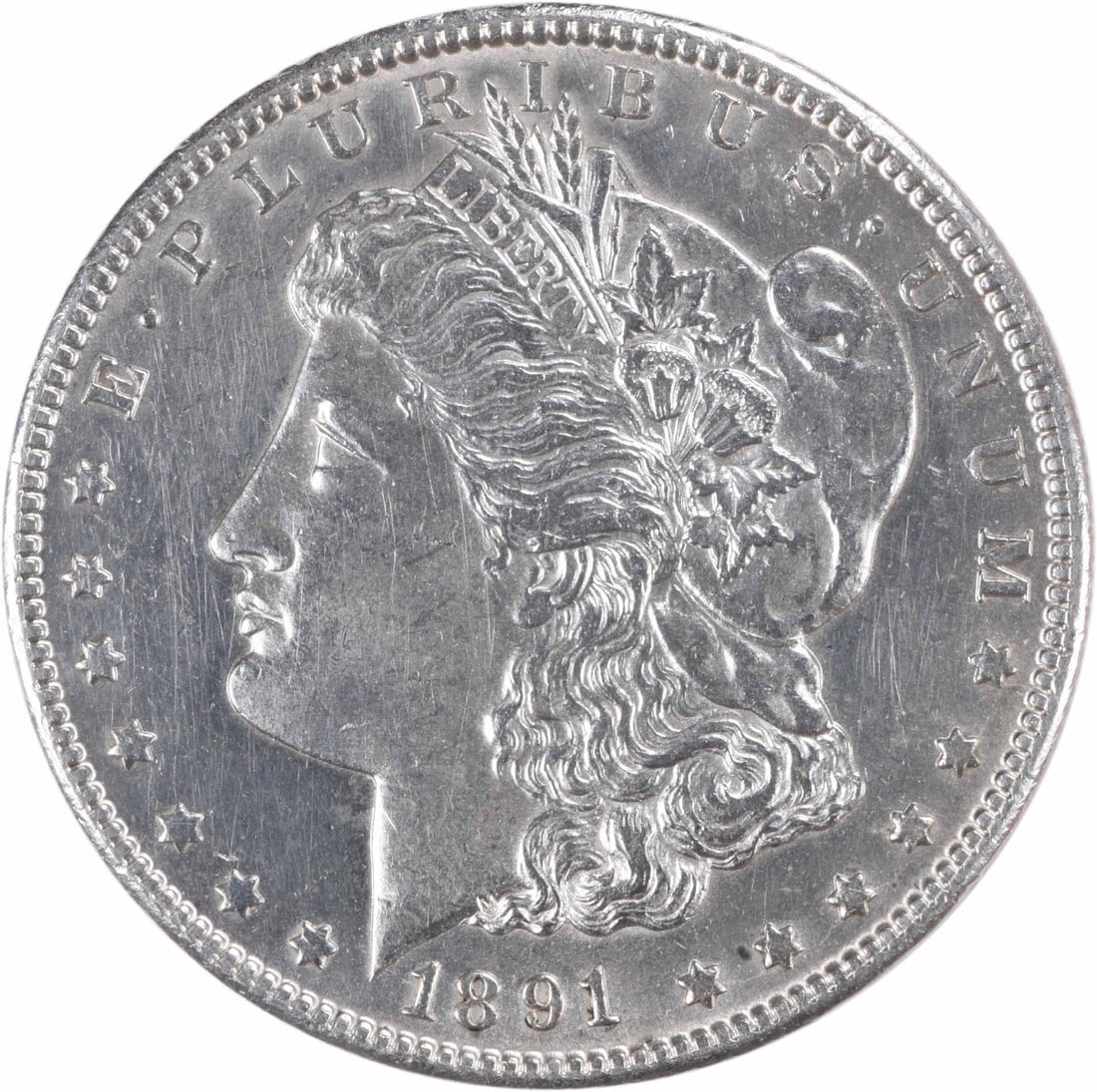 Carson City 1891 Morgan Dollar AU Grade Uncertified 90 Silver Coin: Carson City 1891 Morgan Dollar AU Grade Uncertified 90 Silver Coin This is an 1891-CC Morgan Silver Dollar featuring the 'CC' mint mark from the Carson City Mint. The coin is composed of 90% silver an