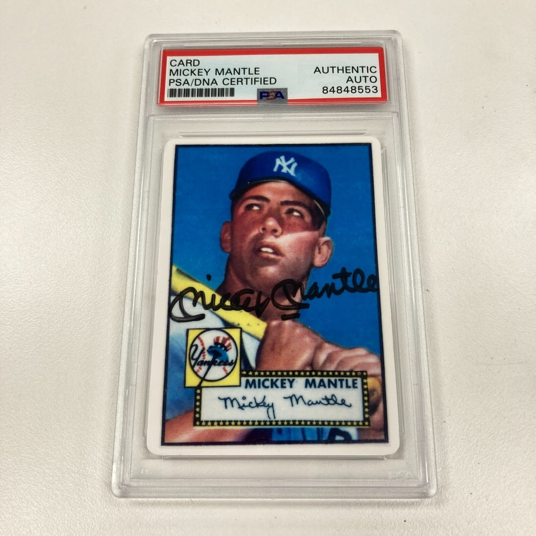1952 Topps Mickey Mantle Signed Rookie Baseball Card PSA Certified: 1952 Topps Mickey Mantle Signed Rookie Baseball Card PSA Certified This is a rare 1952 Topps Mickey Mantle signed porcelain baseball card, a must-have for any baseball memorabilia collector. The card