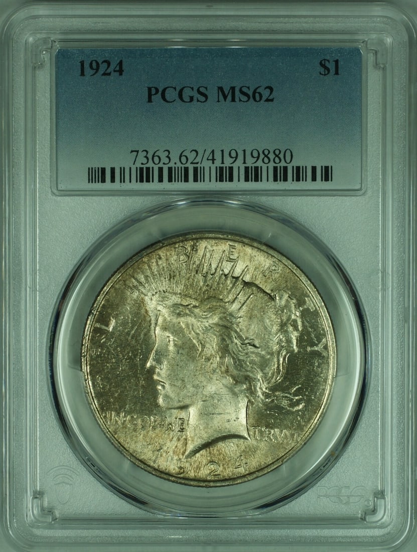 PCGS MS-62 1924 Peace Dollar Silver Coin with Toning: PCGS MS-62 1924 Peace Dollar Silver Coin with Toning This is a 1924 Peace Silver Dollar, graded MS-62 by PCGS. The coin is uncirculated, features attractive toning, and was minted in Philadelphia. It