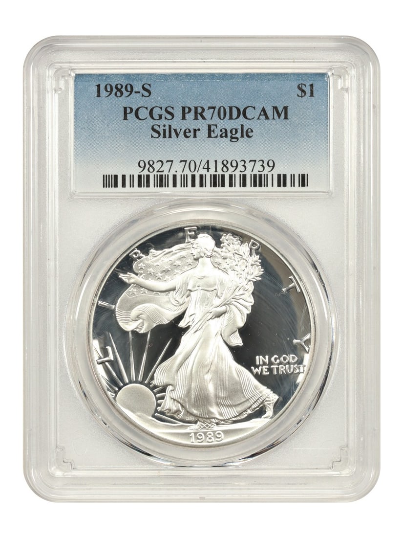 1989 PR70DCAM Silver Eagle Dollar Coin Graded by PCGS: 1989 PR70DCAM Silver Eagle Dollar Coin Graded by PCGS This is a 1989-S $1 Silver Eagle, certified by PCGS with a PR70DCAM grade, indicating a flawless proof coin with deep cameo contrast. The coin is