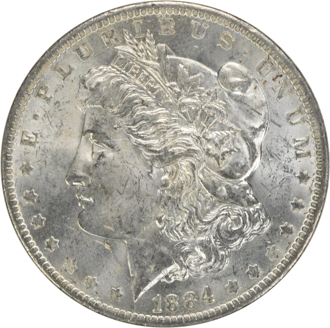 1884-O Morgan Silver Dollar Brilliant Uncirculated Uncertified: 1884-O Morgan Silver Dollar Brilliant Uncirculated Uncertified This 1884-O Morgan Silver Dollar features a brilliant uncirculated finish, showcasing the exquisite detail and artistry typical of the Mo