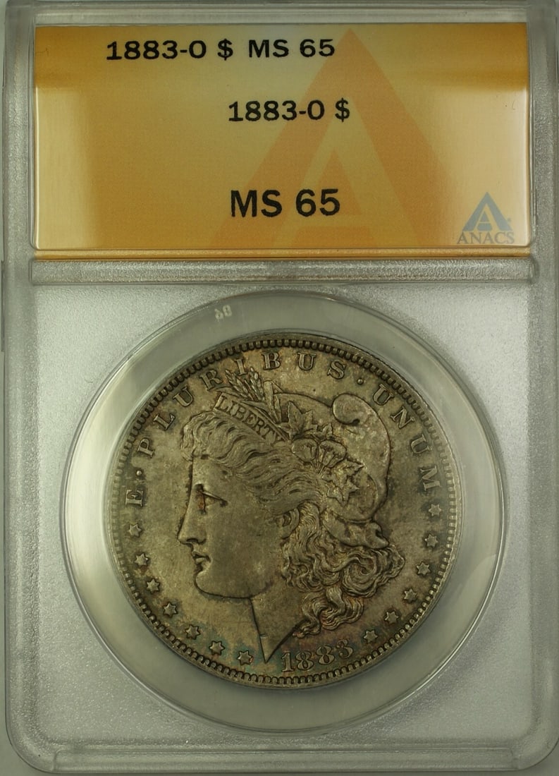 ANACS MS-65 1883-O Morgan Dollar New Orleans Silver Toned Uncirculated: ANACS MS-65 1883-O Morgan Dollar New Orleans Silver Toned Uncirculated This is an 1883-O Morgan Silver Dollar graded MS-65 by ANACS. The coin was minted in New Orleans and is composed of silver. It fe