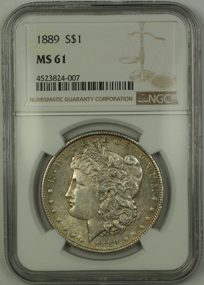 NGC MS 61 1889 Morgan Dollar Philadelphia Silver Coin with Toning: NGC MS 61 1889 Morgan Dollar Philadelphia Silver Coin with Toning This 1889 Morgan Silver Dollar is graded MS 61 by NGC and features attractive toning. Struck in Philadelphia, this uncirculated coin i