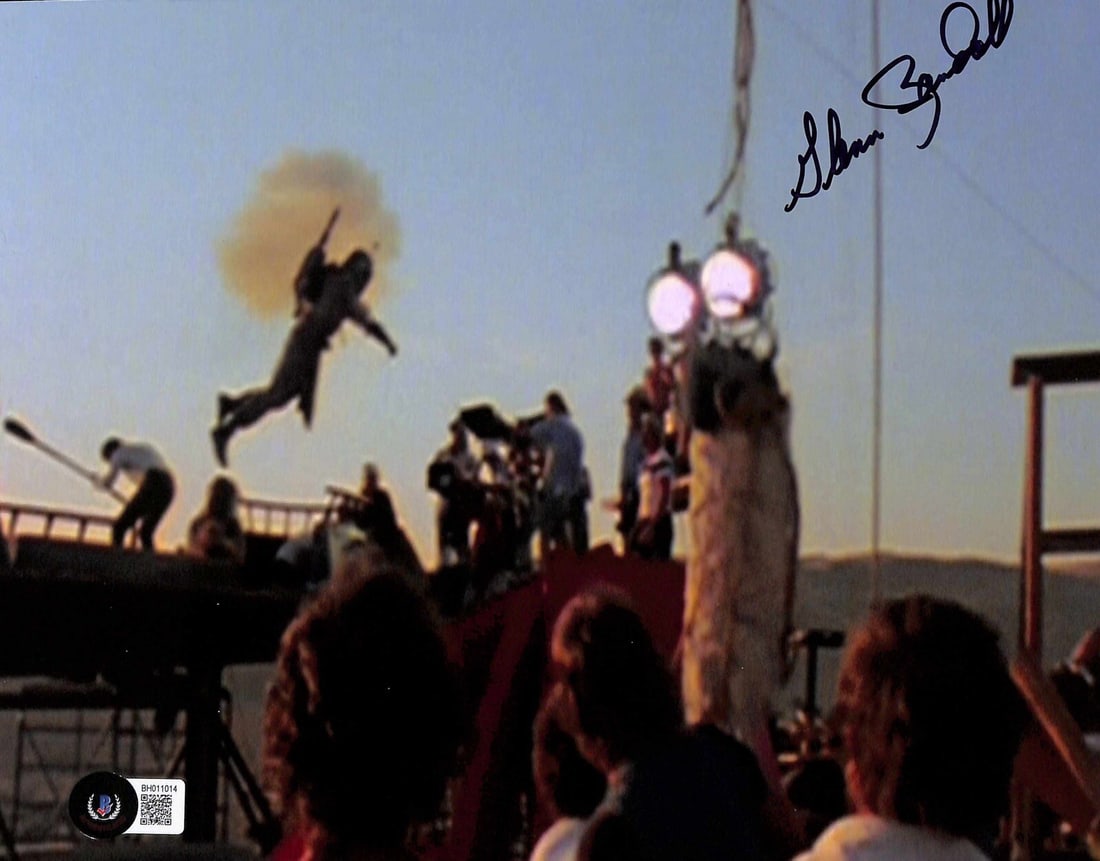 8x10 Photo Signed by Glenn Randall Boba Fett Stuntman Beckett Authenticated: 8x10 Photo Signed by Glenn Randall Boba Fett Stuntman Beckett Authenticated This 8x10 color photograph features a genuine autograph by Glenn Randall, the stuntman for Boba Fett in Star Wars: Return of