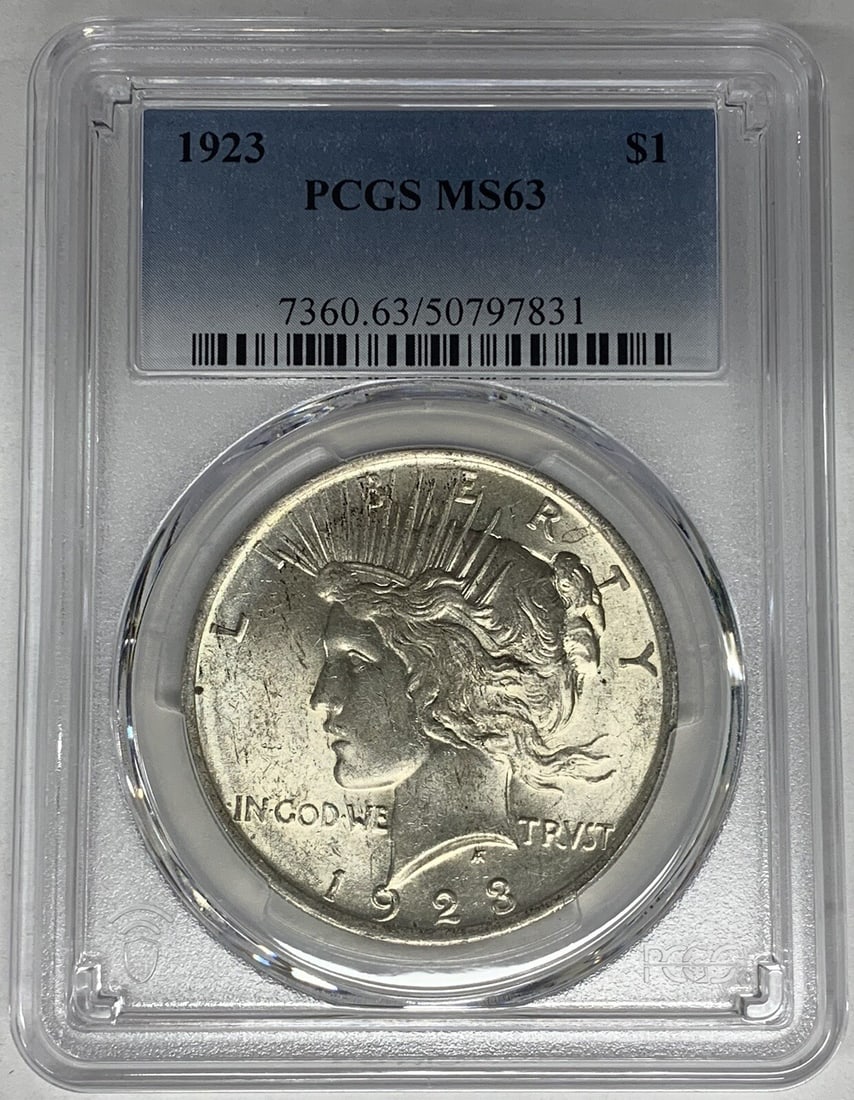 PCGS MS 63 Peace Dollar 1923 Silver Coin United States: PCGS MS 63 Peace Dollar 1923 Silver Coin United States This is a 1923 Peace Silver Dollar coin from the United States, graded MS 63 by PCGS. The coin is composed of silver and is uncirculated. It has