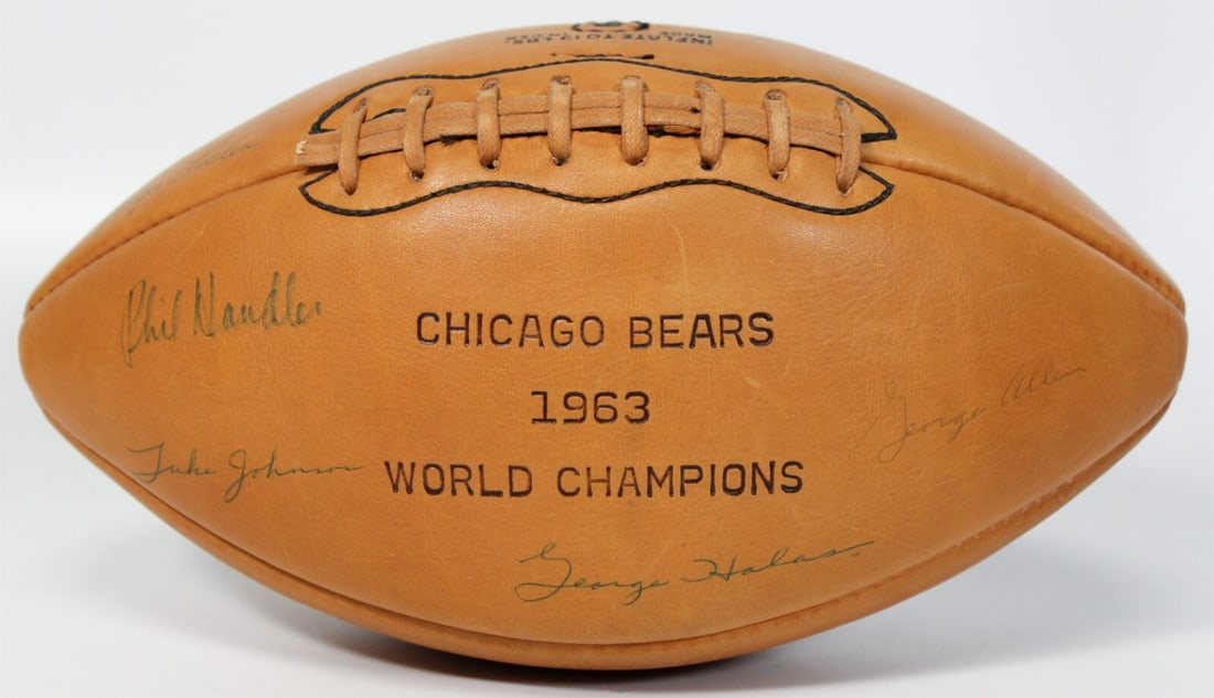 1963 Chicago Bears Team Signed Football with JSA COA 38 Signatures: 1963 Chicago Bears Team Signed Football with JSA COA 38 Signatures This vintage Wilson football features the signatures of members from the legendary 1963 NFL Champion Chicago Bears, authenticated by