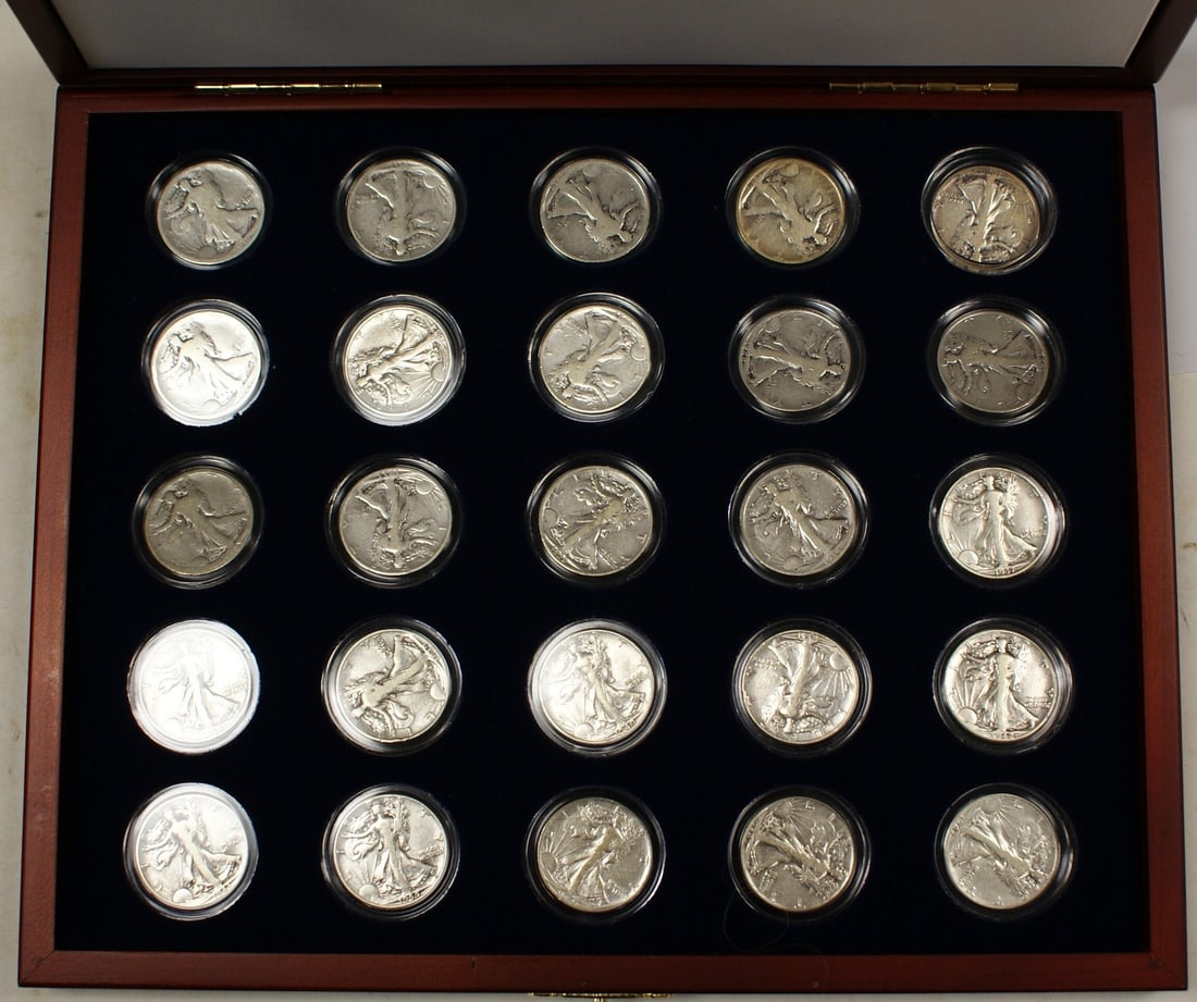 Set of 25 Walking Liberty Half Dollars with COA in Display Case: Set of 25 Walking Liberty Half Dollars with COA in Display Case This collection features 25 circulated Silver Walking Liberty Half-Dollars, each certified by ANACS with a grade of AG 3. The coins span