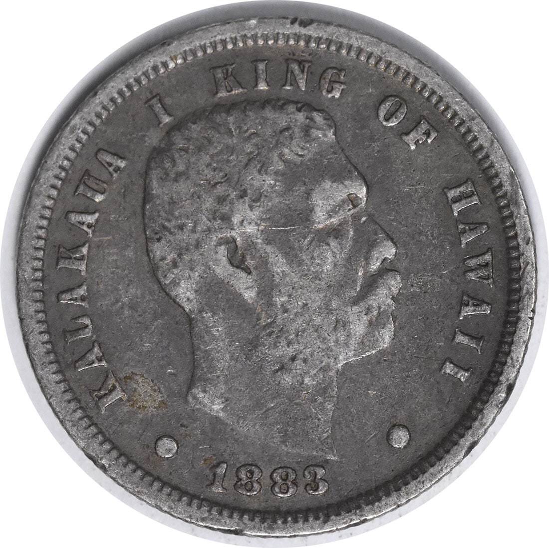 Kingdom of Hawaii 1883 Silver Dime VF Grade Uncertified Coin: Kingdom of Hawaii 1883 Silver Dime VF Grade Uncertified Coin This 1883 Hawaiian dime originates from the Kingdom of Hawaii and was minted in Philadelphia. It is composed of silver, has a diameter of 1