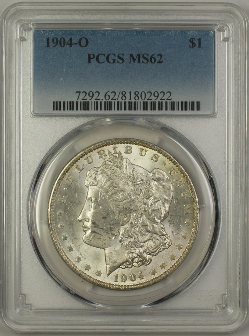PCGS MS62 1904-O Silver Morgan Dollar New Orleans Mint Uncirculated Coin: PCGS MS62 1904-O Silver Morgan Dollar New Orleans Mint Uncirculated Coin This is a 1904-O Morgan Silver Dollar $1 coin certified by PCGS with a grade of MS-62. The coin is uncirculated and was minted