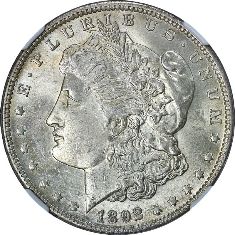 NGC MS63 1892-O Silver Dollar with Strong Luster and Strike: NGC MS63 1892-O Silver Dollar with Strong Luster and Strike This 1892-O Morgan Silver Dollar is certified by NGC with a grade of MS63, indicating a well-preserved uncirculated coin. It features attrac