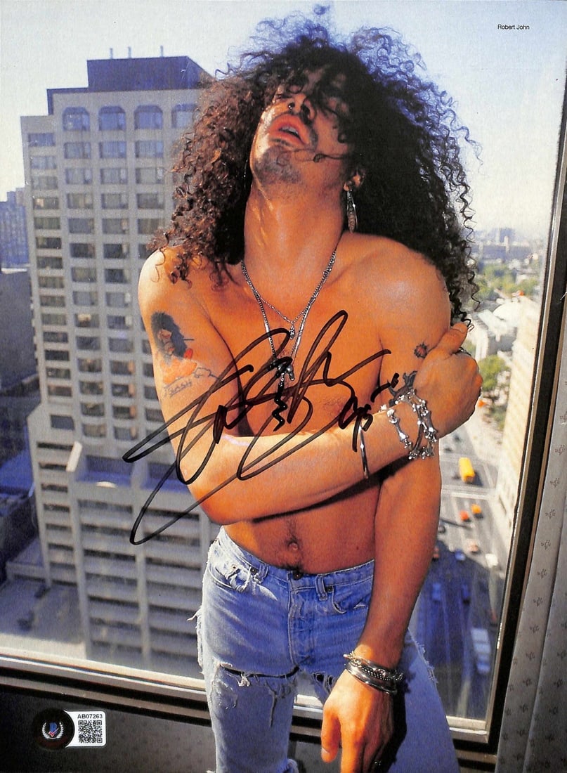 Slash Guns N Roses Signed 8.5x11 Photo Beckett LOA: Slash Guns N Roses Signed 8.5x11 Photo Beckett LOA This is an original 8 1/2 x 11 color magazine photograph featuring Slash, the legendary guitarist of Guns N' Roses. The photograph has been autograph