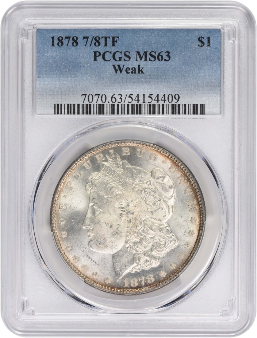 1878 Morgan Silver Dollar Uncirculated MS63 PCGS Certified: 1878 Morgan Silver Dollar Uncirculated MS63 PCGS Certified This 1878 Morgan Silver Dollar is a remarkable collectible, graded MS63 by PCGS. Struck in Philadelphia, it features a composition of 90% sil