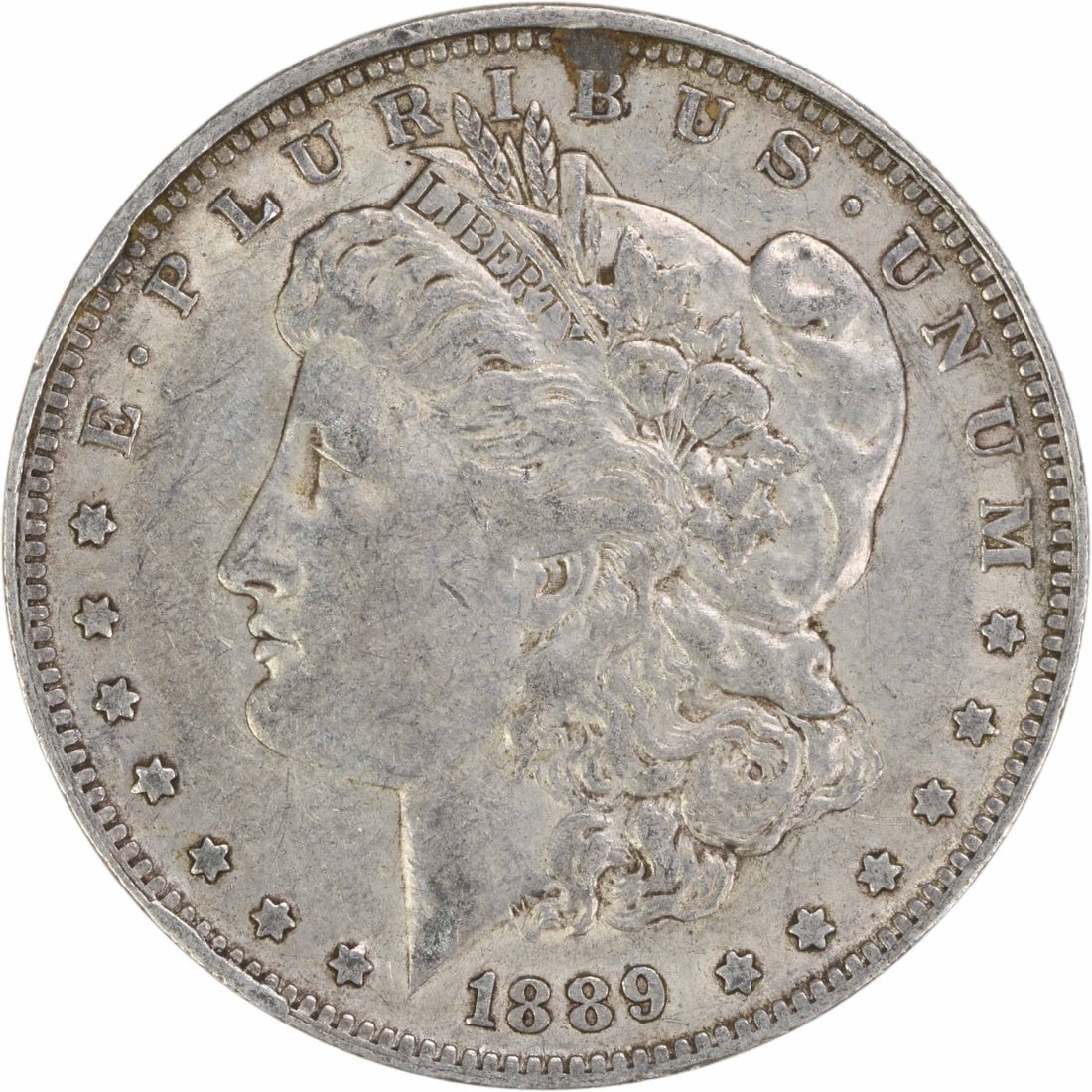 Morgan Dollar 1889 O Extra Fine Circulated Silver Uncertified Coin: Morgan Dollar 1889 O Extra Fine Circulated Silver Uncertified Coin This 1889-O Morgan Silver Dollar was minted in New Orleans and is composed of 90% silver and 10% copper. Designed by George T. Morgan