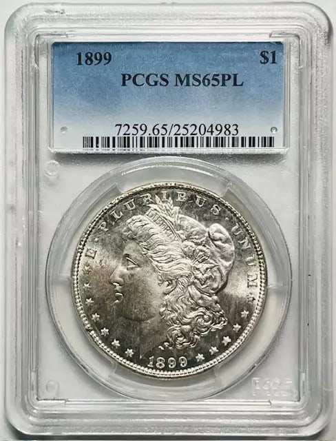 PCGS MS65 PL 1899 Philadelphia Morgan Silver Dollar Uncirculated: PCGS MS65 PL 1899 Philadelphia Morgan Silver Dollar Uncirculated This is an 1899 Morgan Silver Dollar graded MS-65 Proof Like (PL) by PCGS. Struck at the Philadelphia Mint, this uncirculated coin is c