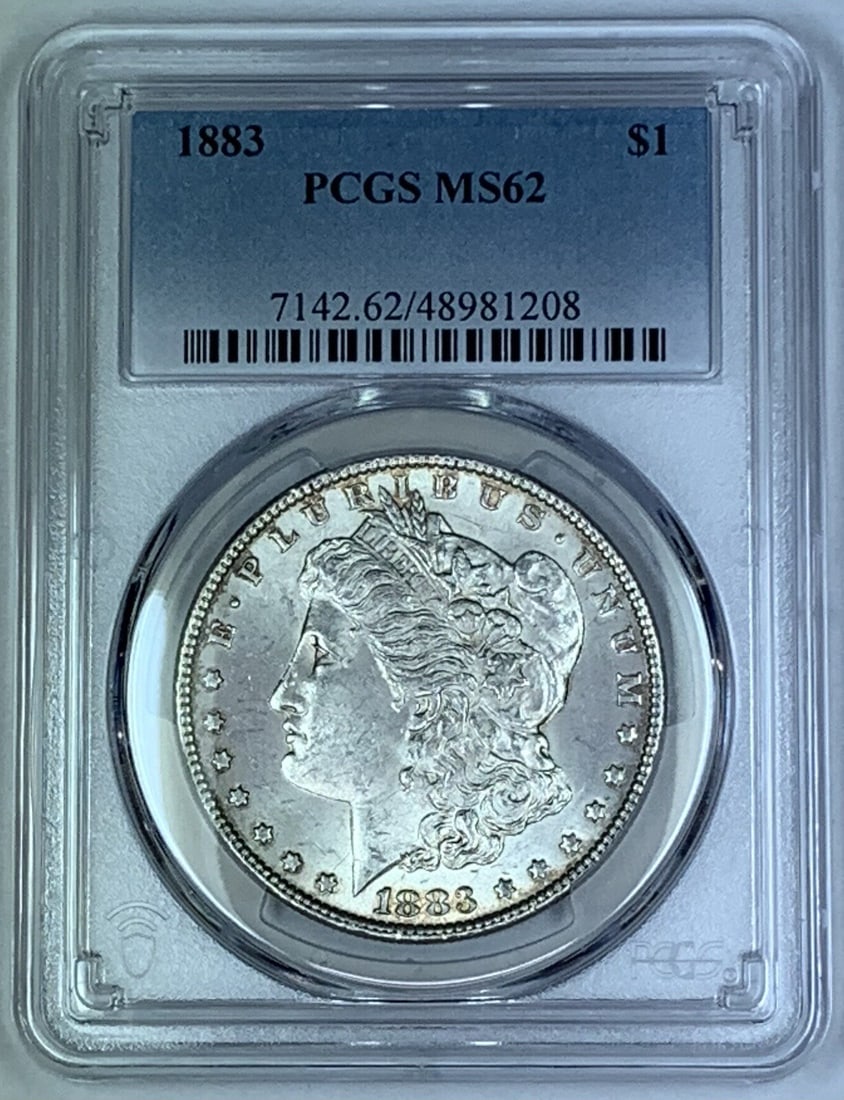 PCGS MS 62 Certified 1883 Morgan Silver Dollar Coin: PCGS MS 62 Certified 1883 Morgan Silver Dollar Coin This is an 1883 Morgan Silver Dollar coin, graded MS 62 by PCGS. The coin is uncirculated and composed of silver. It originates from the United Stat