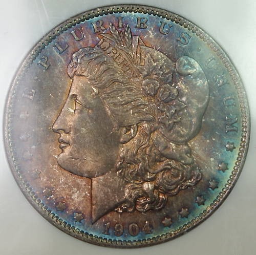 NGC MS-65 1904-O Morgan Dollar with Attractive Toning Both Sides: NGC MS-65 1904-O Morgan Dollar with Attractive Toning Both Sides This 1904-O Morgan Silver Dollar features attractive toning on both sides and has been certified by NGC with a grade of MS 65. Struck a