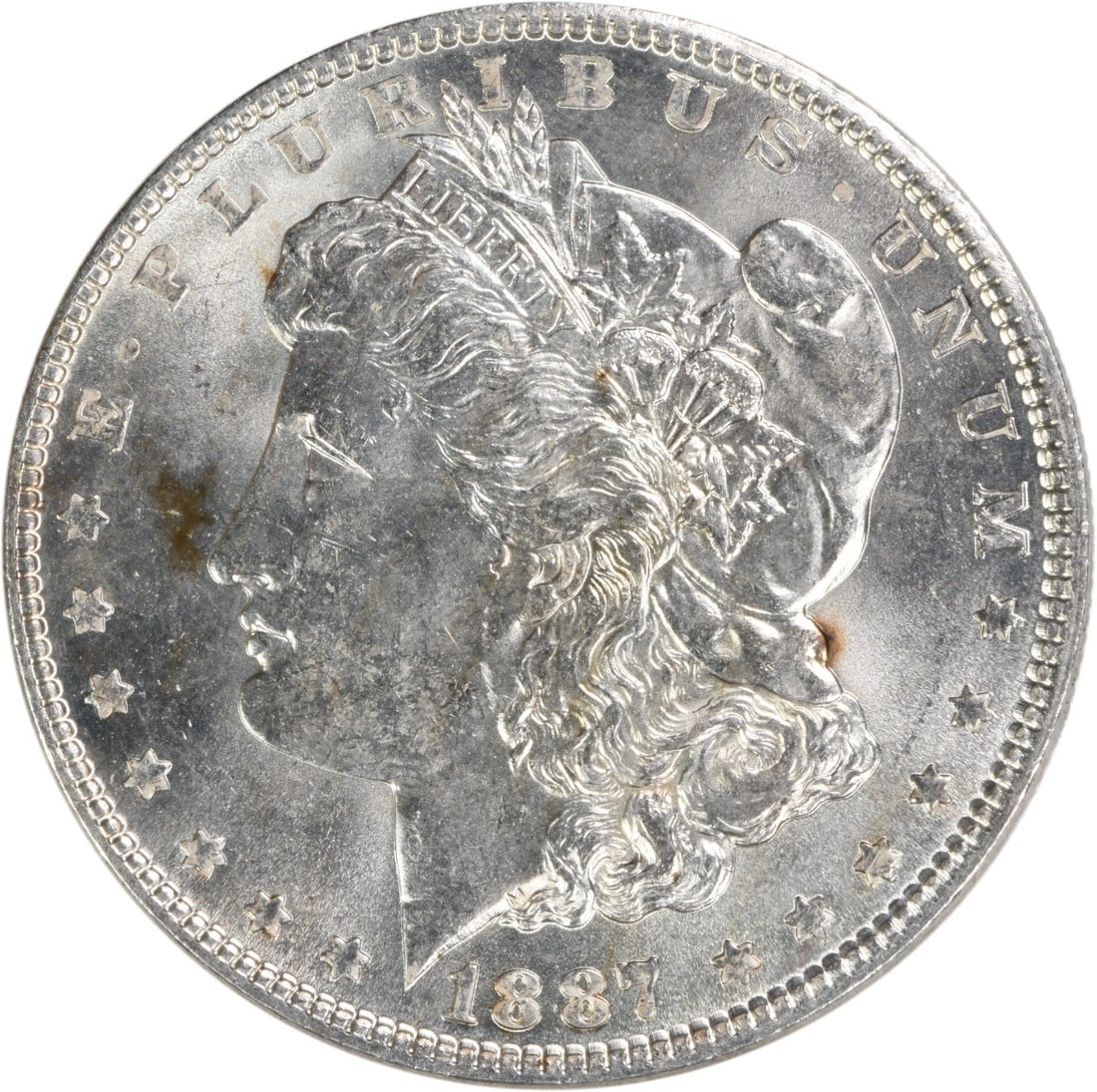 1887 Morgan Silver Dollar Choice BU Uncertified Silver Coin: 1887 Morgan Silver Dollar Choice BU Uncertified Silver Coin This 1887 Morgan Silver Dollar is a stunning example of American numismatic history. Featuring a Choice Brilliant Uncirculated (BU) grade, t