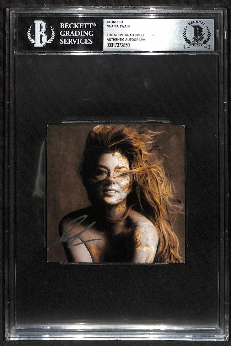 Shania Twain Signed 'Queen of Me' CD Insert Beckett Authenticated: Shania Twain Signed 'Queen of Me' CD Insert Beckett Authenticated This is an autographed CD insert of Shania Twain's album 'Queen of Me', signed in silver permanent marker. The signature has been auth