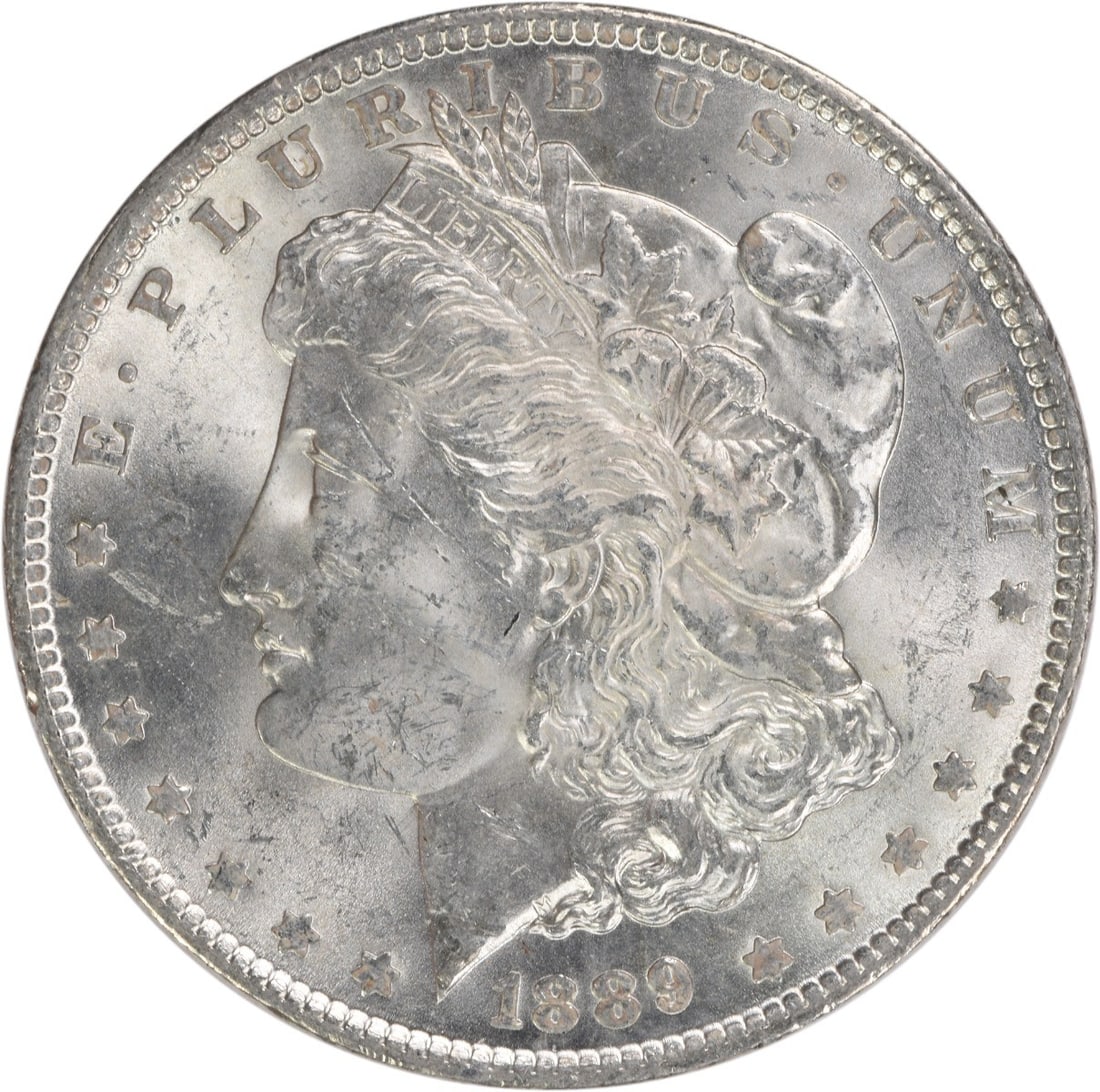 1889 Morgan Silver Dollar Choice BU Uncertified Silver Coin: 1889 Morgan Silver Dollar Choice BU Uncertified Silver Coin This 1889 Morgan Silver Dollar is in Choice BU condition, showcasing its stunning uncirculated quality. The coin is composed entirely of sil
