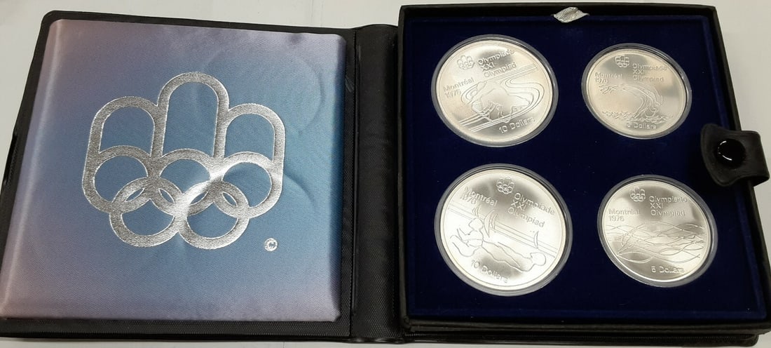 Four Coin .925 Silver Set 1975 Montreal Olympics in Original RCM Packaging: Four Coin .925 Silver Set 1975 Montreal Olympics in Original RCM Packaging This set features four commemorative coins from the 1975 Canada Montreal Olympic Games, struck in 0.925 fine silver. The set