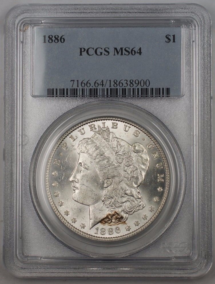 PCGS MS64 1886 Silver Morgan Dollar Uncirculated Philadelphia Mint Coin: PCGS MS64 1886 Silver Morgan Dollar Uncirculated Philadelphia Mint Coin This 1886 US Morgan Silver Dollar is certified by PCGS with a grade of MS 64. Minted in Philadelphia, it features a silver compo