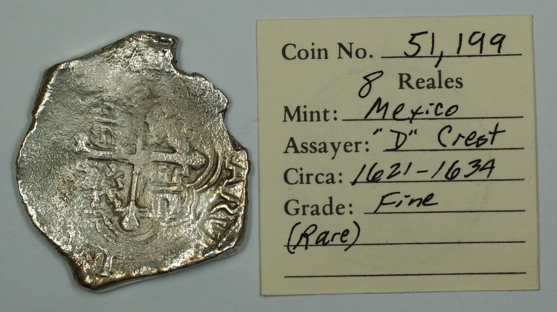 Mexico Circa 1621-1634 Silver 8 Reales Cob D Crest Fine Grade Coin: Mexico Circa 1621-1634 Silver 8 Reales Cob D Crest Fine Grade Coin This is a rare Mexico Silver 8 Reales cob coin from circa 1621-1634, featuring the "D" crest. The coin is graded as Fine and is in ci
