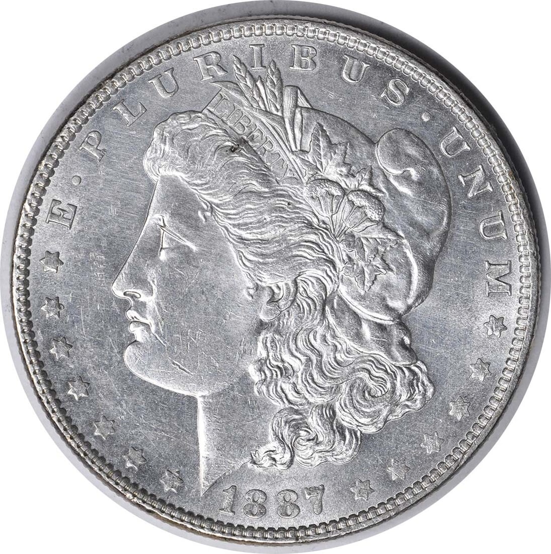 1887 Morgan Silver Dollar BU Uncertified Silver Coin: 1887 Morgan Silver Dollar BU Uncertified Silver Coin This 1887 Morgan Silver Dollar is an uncirculated coin that showcases the classic design and historical significance of the Morgan series. It featu