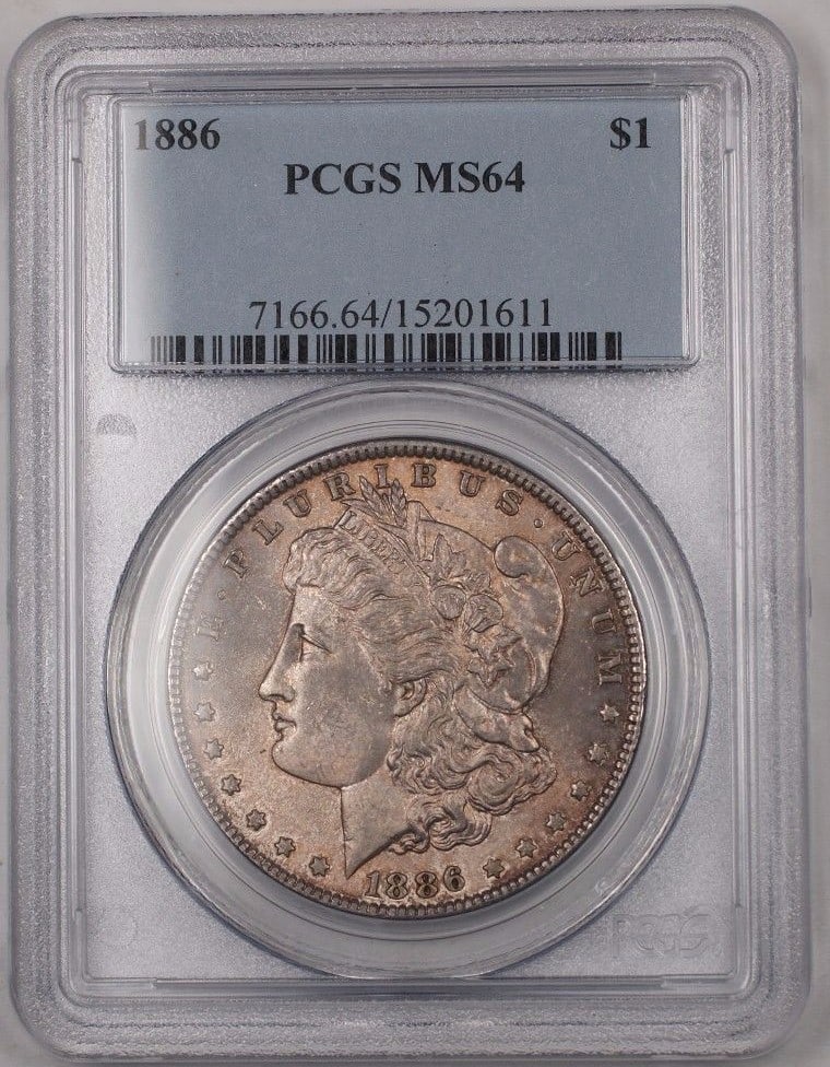 PCGS MS-64 1886 Morgan Dollar Silver Coin with Toning: PCGS MS-64 1886 Morgan Dollar Silver Coin with Toning This 1886 US Morgan Silver Dollar is an uncirculated coin graded MS-64 by PCGS. Minted in Philadelphia, it features a silver composition with a fi