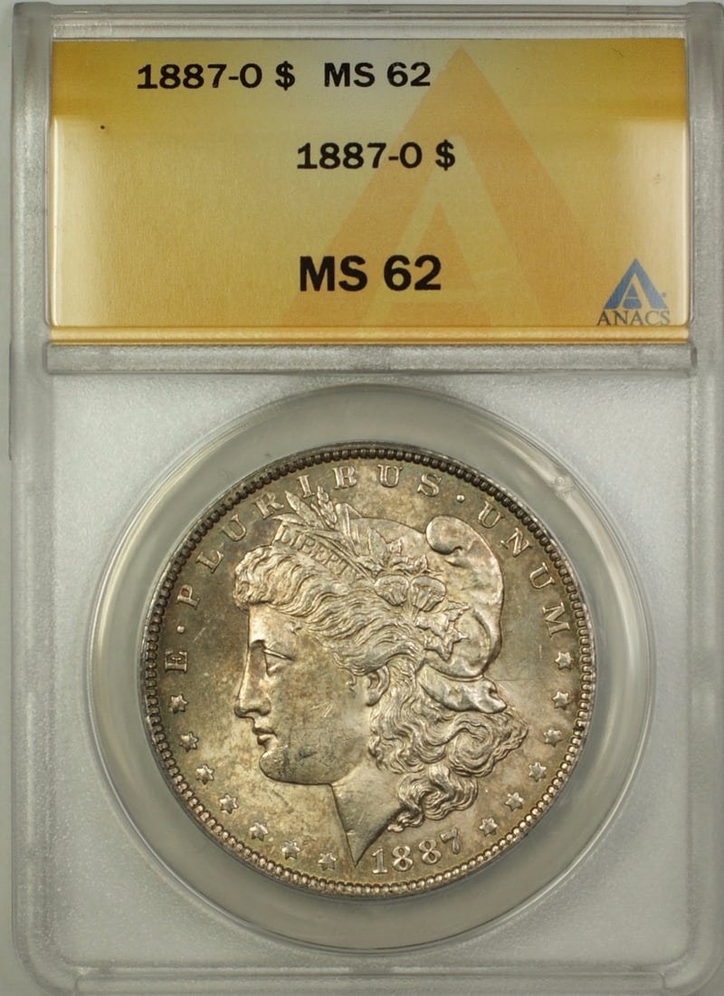 ANACS MS62 1887-O Morgan Dollar Silver $1 Coin with Toning: ANACS MS62 1887-O Morgan Dollar Silver $1 Coin with Toning This 1887-O Morgan Silver Dollar is a $1 coin minted in New Orleans. It is composed of silver and has been graded MS 62 by ANACS. The coin fe