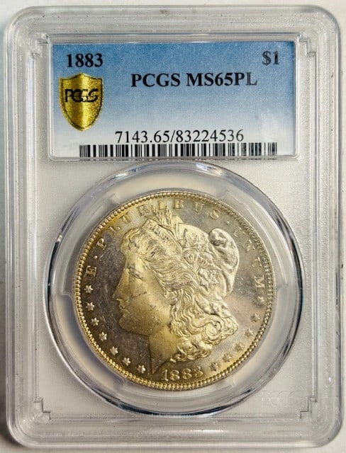 PCGS MS65 PL 1883 Philadelphia Silver Morgan Dollar: PCGS MS65 PL 1883 Philadelphia Silver Morgan Dollar This is an 1883 Morgan Silver Dollar from the Philadelphia Mint, certified by PCGS as MS-65 Proof Like (PL). The coin is composed of silver and is u