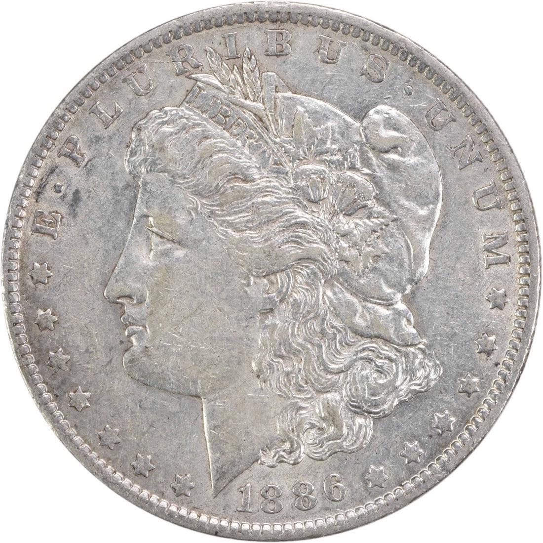 1886-O Morgan Silver Dollar EF Uncertified 90% Silver Coin: 1886-O Morgan Silver Dollar EF Uncertified 90% Silver Coin This 1886-O Morgan Silver Dollar features a stunning design by George T. Morgan and is a notable piece of numismatic history. Struck in New O