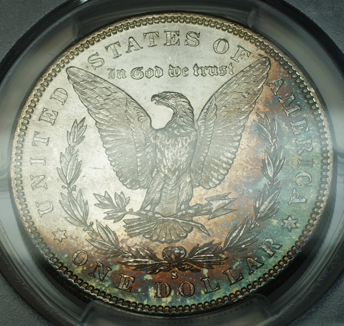 PCGS MS65 1881 San Francisco Morgan Dollar with Colorful Reverse Crescent Toning: PCGS MS65 1881 San Francisco Morgan Dollar with Colorful Reverse Crescent Toning This is an uncirculated 1881-S Morgan Silver Dollar graded MS-65 by PCGS. The coin features beautiful multi-colored cre