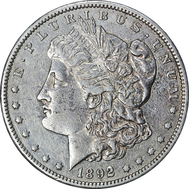 XF Plus 1892 Carson City Morgan Silver Dollar Key Date US Coin: XF Plus 1892 Carson City Morgan Silver Dollar Key Date US Coin This 1892-CC Morgan Silver Dollar is a key date coin featuring attractive eye appeal and a well-defined strike. The coin exhibits pleasin