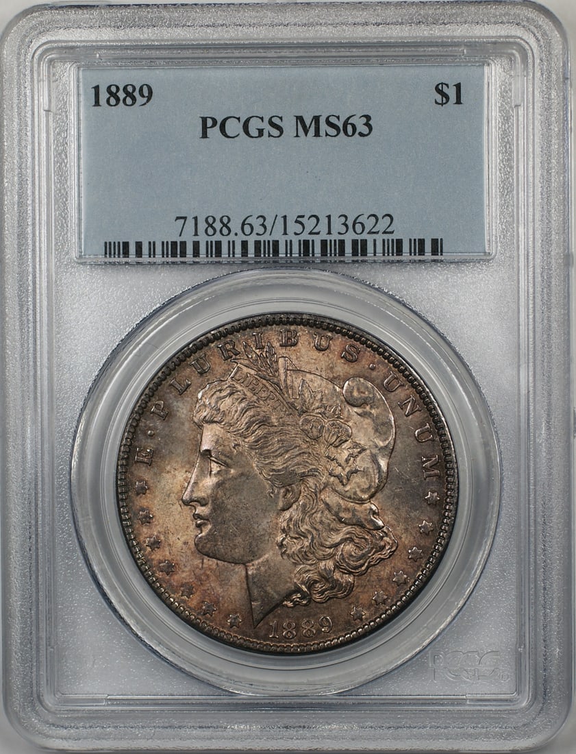 PCGS MS63 1889 Morgan Dollar Silver Coin With Toning: PCGS MS63 1889 Morgan Dollar Silver Coin With Toning This 1889 Morgan Silver Dollar features a toned finish and is graded MS-63 by PCGS. Minted in Philadelphia, this uncirculated coin is composed of s