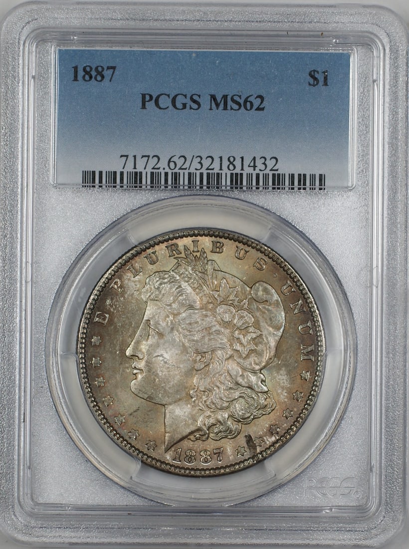 PCGS MS-62 1887 Silver Morgan Dollar with Obverse and Reverse Toning: PCGS MS-62 1887 Silver Morgan Dollar with Obverse and Reverse Toning This is an 1887 Morgan Silver Dollar graded MS-62 by PCGS. The coin is uncirculated and features attractive toning on both the obve