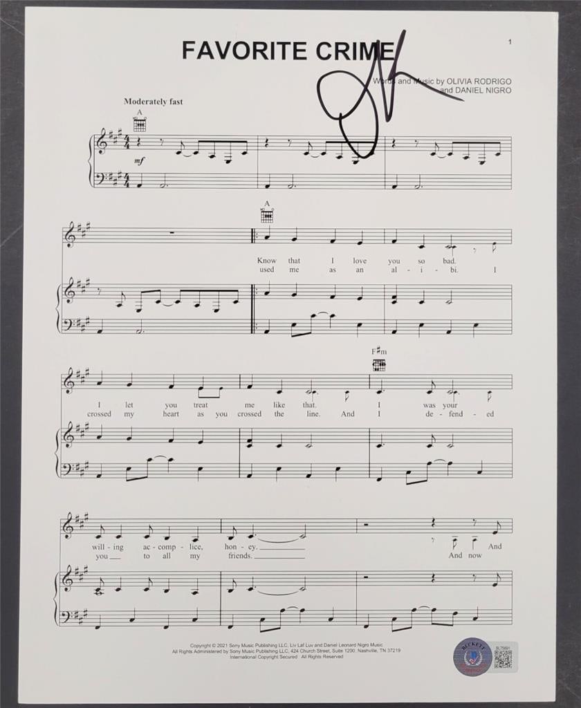 Original Olivia Rodrigo Favorite Crime Signed 8.5x11 Lyric Sheet Beckett Authenticated: Original Olivia Rodrigo Favorite Crime Signed 8.5x11 Lyric Sheet Beckett Authenticated This is an original 8.5x11 inch lyric sheet for the song "Favorite Crime," personally signed by Olivia Rodrigo. T