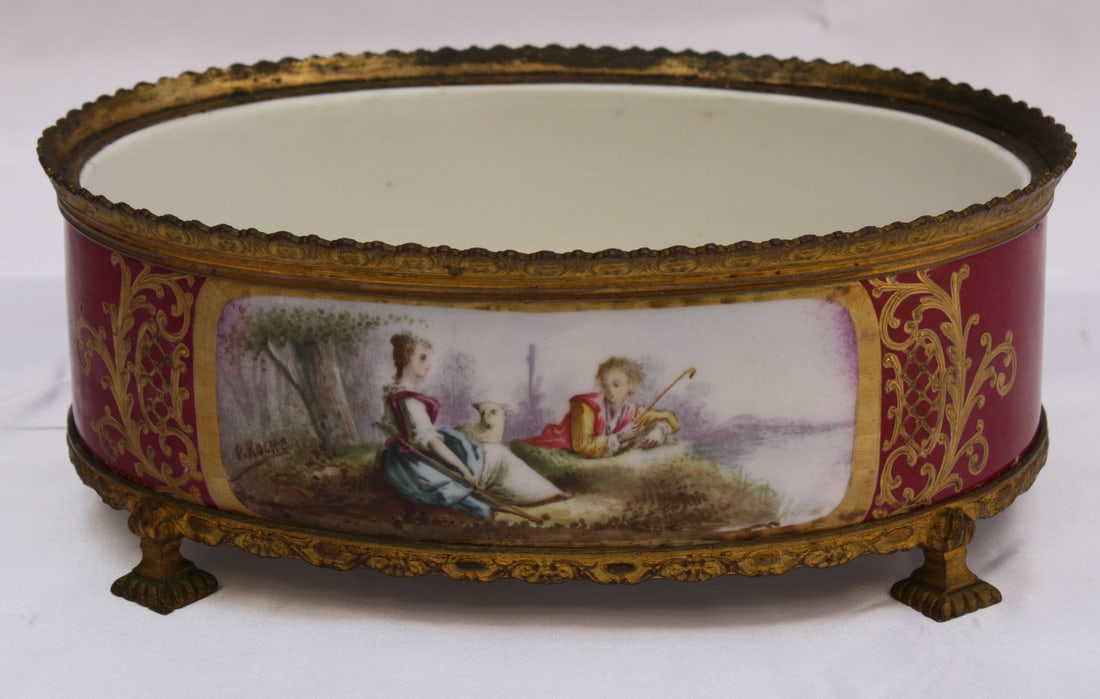 1900 French Sevres Signed Bronze Hand Painted Porcelain Centerpiece: 1900 French Sevres Signed Bronze Hand Painted Porcelain Centerpiece This magnificent early 1900s French Sevres center piece showcases exquisite hand-painted porcelain and intricate bronze detailing. F