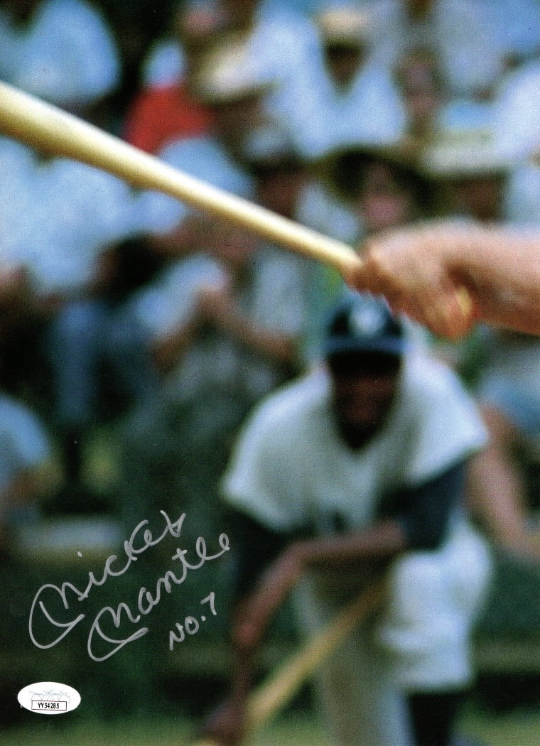 Mickey Mantle Signed Photo Yankees No. 7 JSA Authenticated 8.5x11.75: Mickey Mantle Signed Photo Yankees No. 7 JSA Authenticated 8.5x11.75 This original autographed book photograph features the legendary Mickey Mantle, known for his iconic No. 7 jersey with the New York
