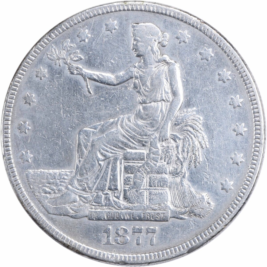1877 Trade Silver Dollar XF by William Barber 90% Silver: 1877 Trade Silver Dollar XF by William Barber 90% Silver This 1877 Trade Silver Dollar is a remarkable piece of numismatic history. Struck at the Philadelphia mint, this coin features a composition of