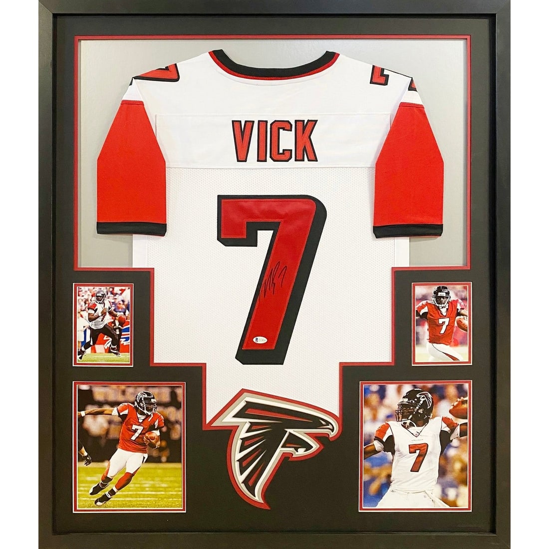 Framed Atlanta Falcons Jersey Signed by Michael Vick with JSA Authentication: Framed Atlanta Falcons Jersey Signed by Michael Vick with JSA Authentication This framed white Atlanta Falcons jersey is autographed by Michael Vick and includes authentication by JSA, featuring a JSA